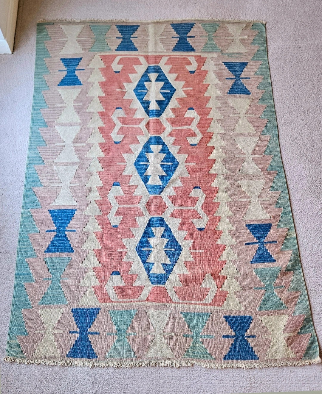 Blush and mint green vintage turkish kilim.