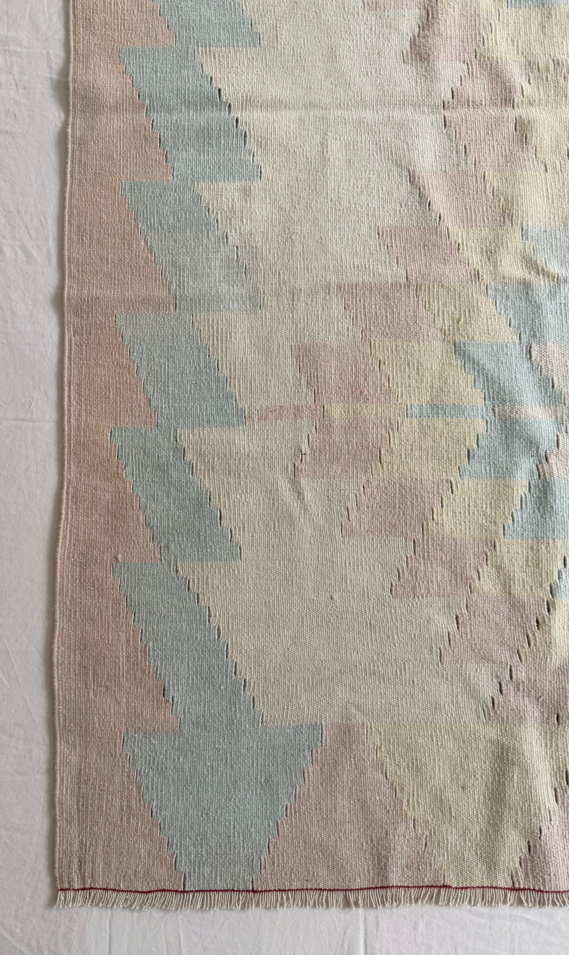 Textile with geometric pattern on a plain background