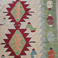 Bright and bold turkish kilim rug, vintage, accent size in green ivory and red. 