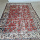 Distressed handwoven turkish wool Rug. Red floral isparta rug