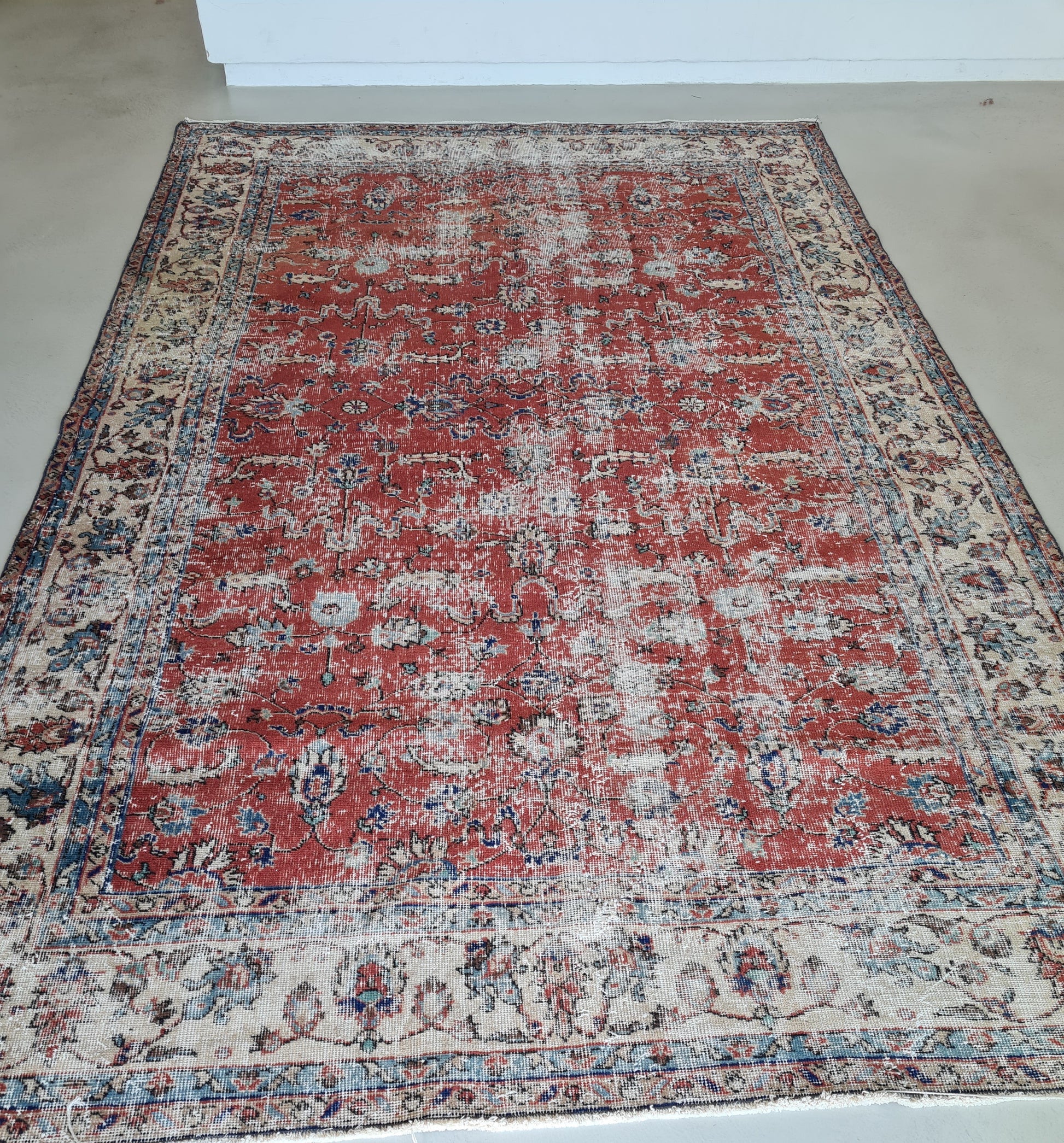 Distressed handwoven turkish wool Rug. Red floral isparta rug