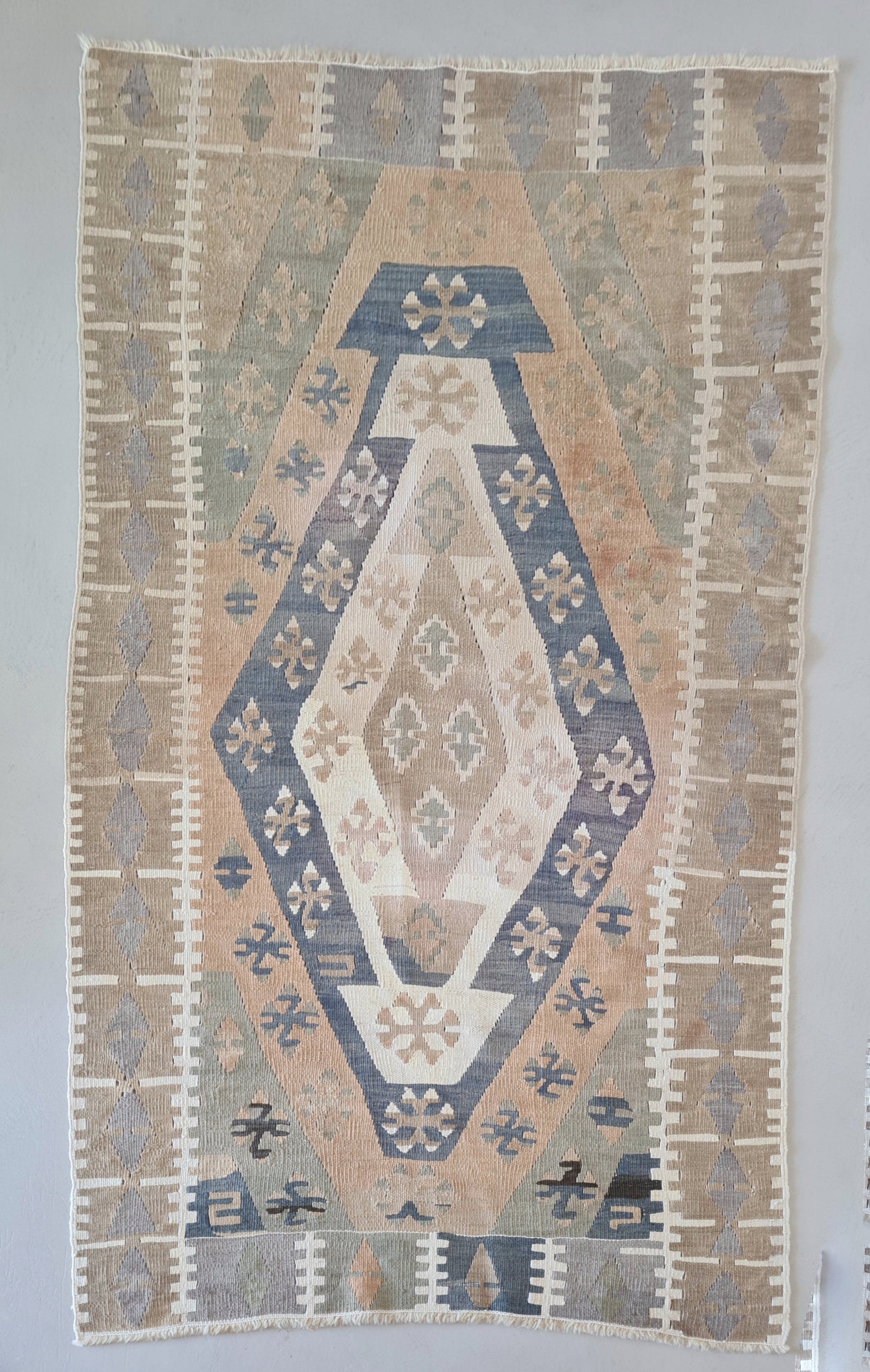 Vintage Turkish Kilim Rug in a muted palette, blues, buttery yellows and pale green