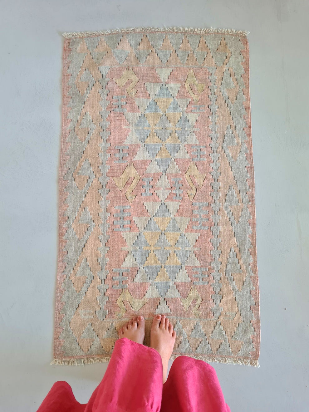 Vintage peachy pink small slit weave kilim rug